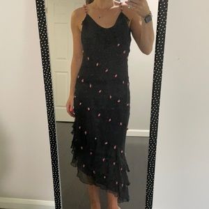 Black asymmetric dress with beating and flowers